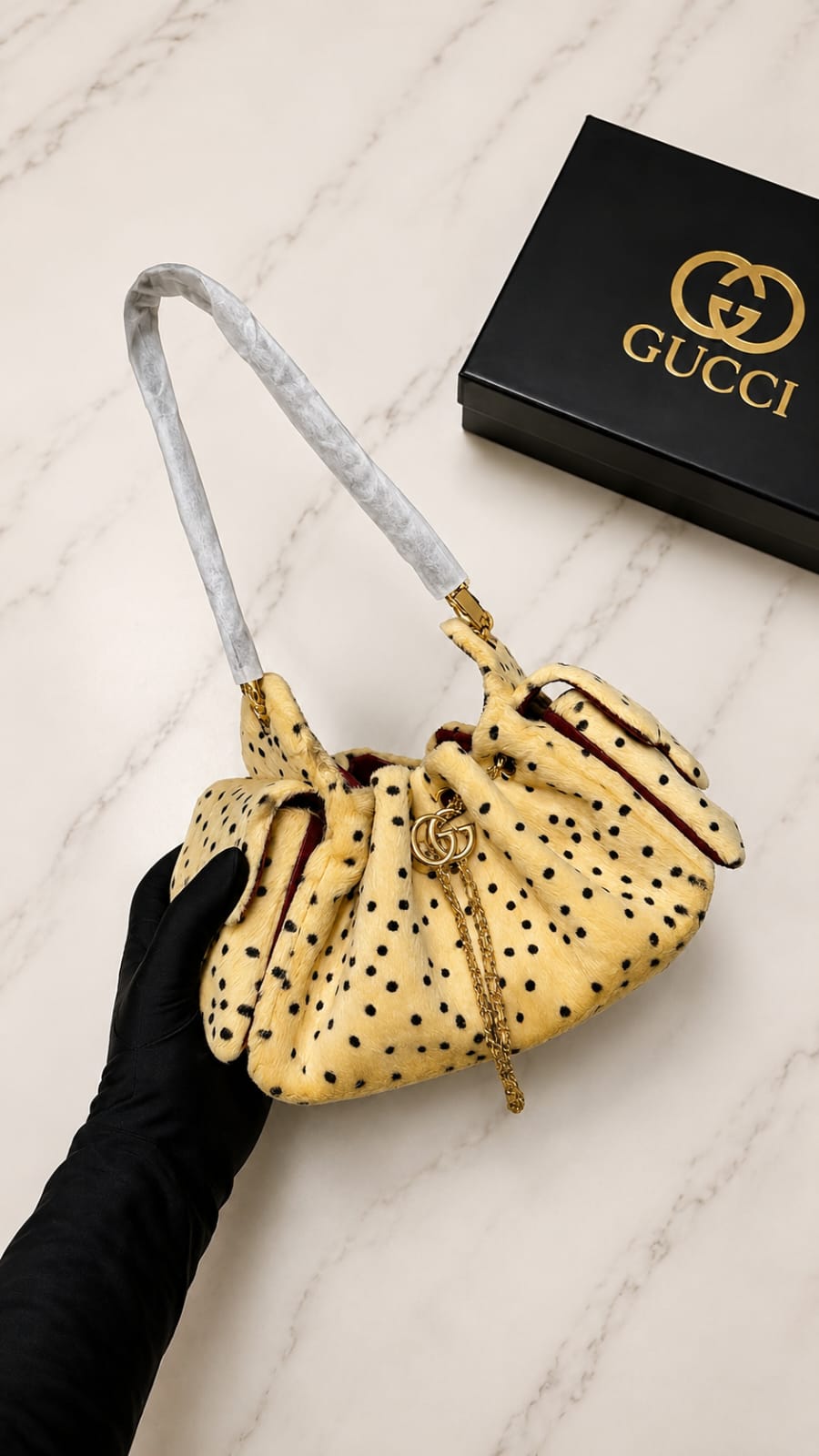Chanel 25 Mini Cheetah Print bag, featured in cream lambskin with black spots.