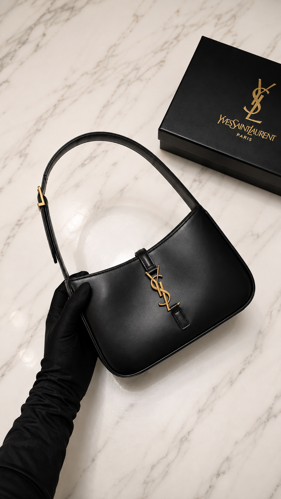 Saint Laurent Le 5 à 7 Hobo Bag in black leather with gold-tone hardware.