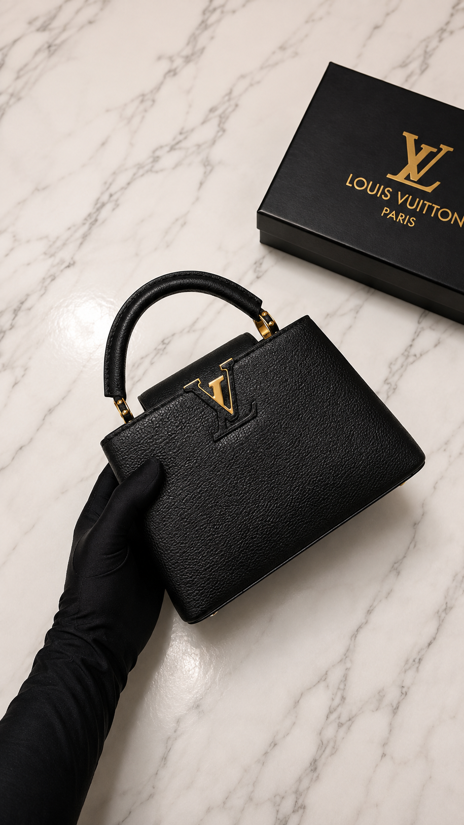 Louis Vuitton Capucines BB bag featuring gold-tone hardware.