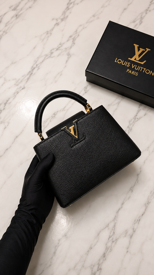 Louis Vuitton Capucines BB bag featuring gold-tone hardware.