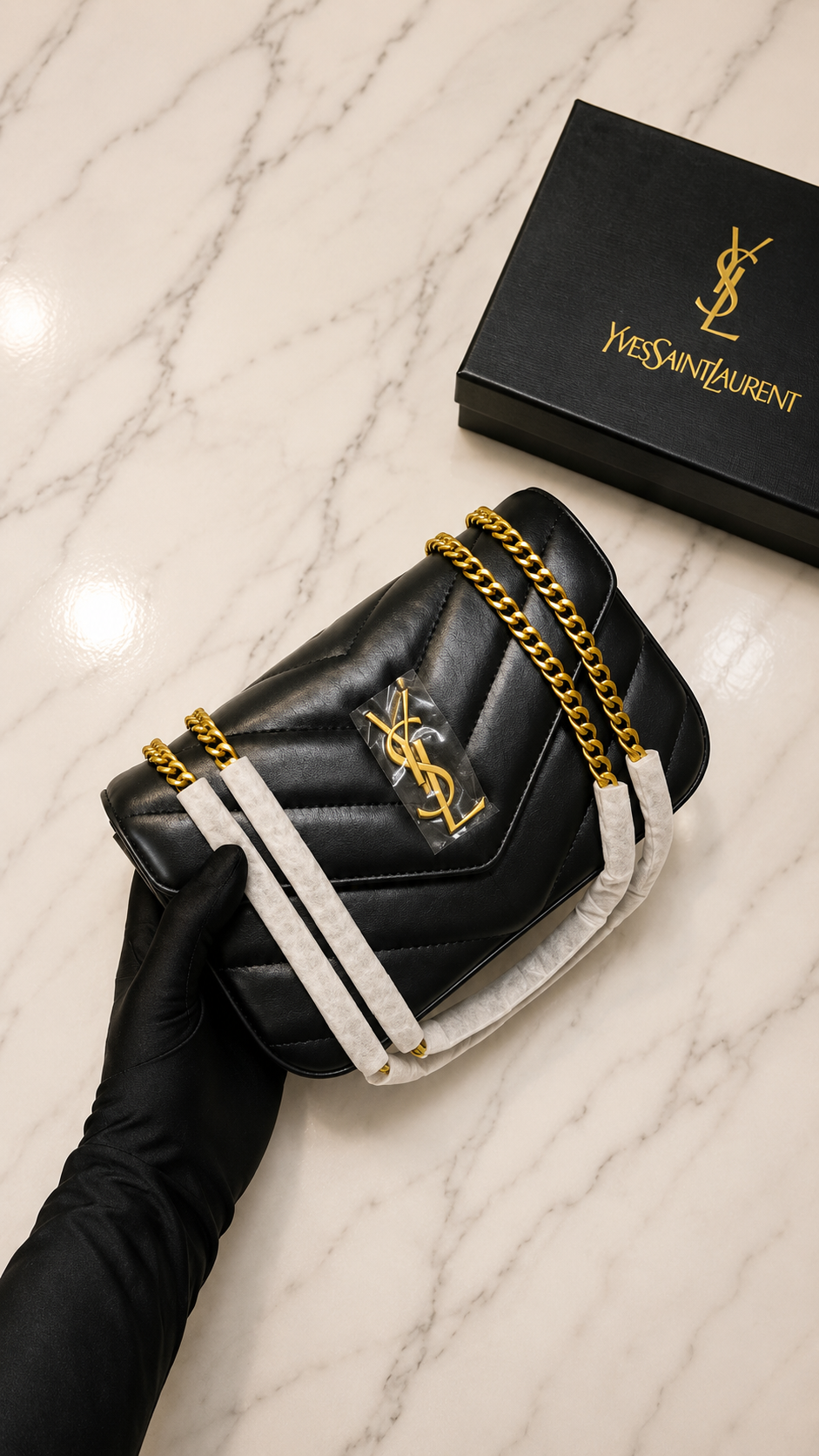 Saint Laurent Small Loulou shoulder bag is crafted from black chevron-quilted lambskin with gold-toned hardware